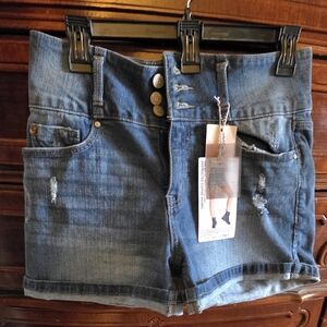 Blue Jean Shorts by Enjean, size M with destructed and Lycra fibers details.